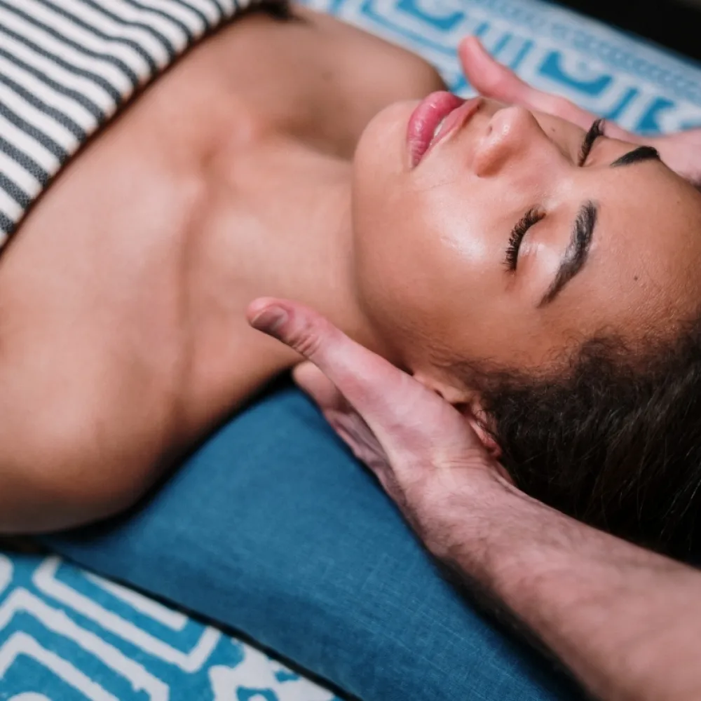 Woman laying down receives a massage