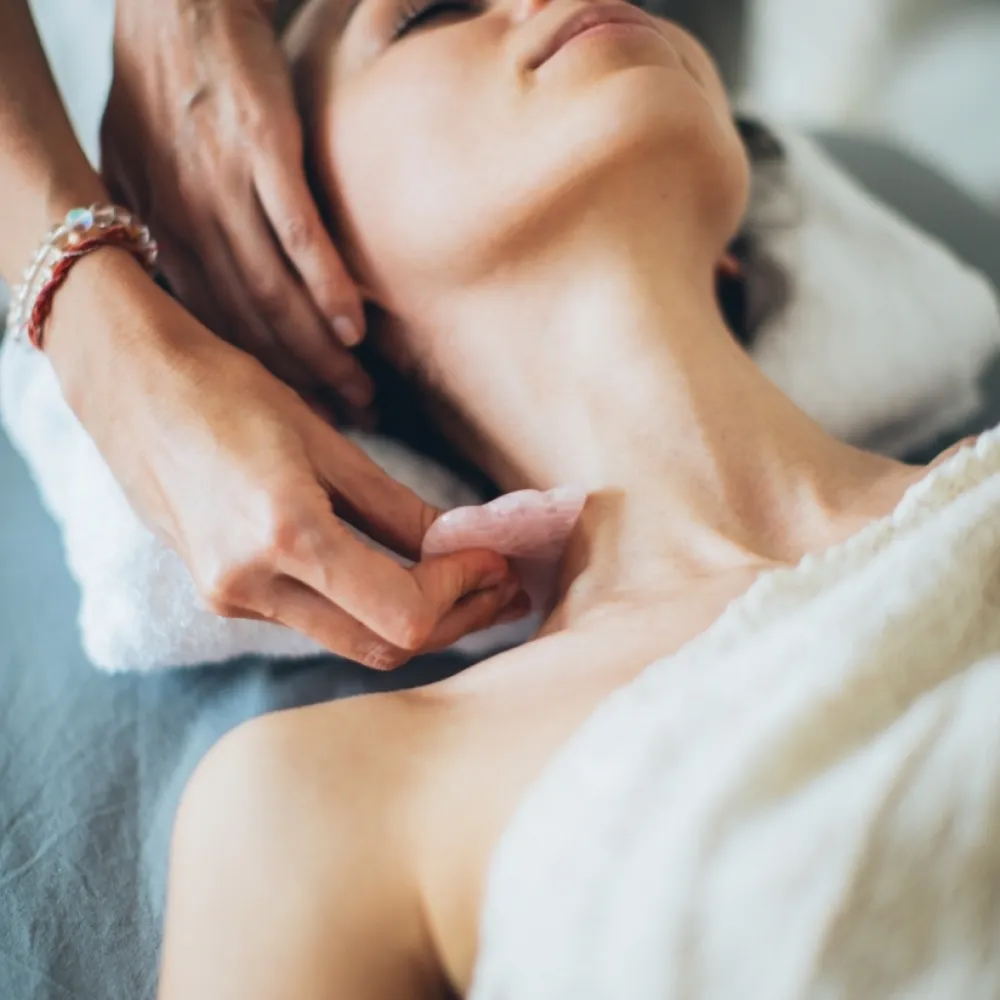 Neck massage for woman laying down